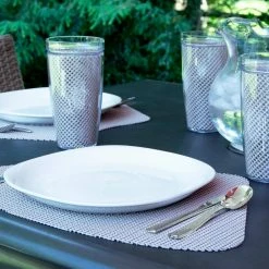 Fishnet 19 in. x 13 in. Tan PVC Covered Jute Wedge Placemat (Set of 6) by Kraftware -Kraftware Sales Store browns tans kraftware placemats 34149 31 1000