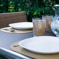 Fishnet 17 in. x 12 in. Camel PVC Covered Jute Oval Placemat (Set of 6) by Kraftware -Kraftware Sales Store browns tans kraftware placemats 38646 4f 1000