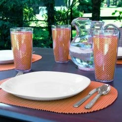 Fishnet 17 in. x 12 in. Spice Orange PVC Covered Jute Oval Placemat (Set of 6) by Kraftware -Kraftware Sales Store oranges peaches kraftware placemats 14846 31 1000