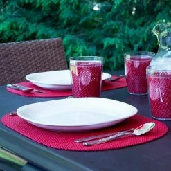 Fishnet 17 in. x 12 in. Flag Red PVC Covered Jute Oval Placemat (Set of 6) by Kraftware -Kraftware Sales Store reds pinks kraftware placemats 33046 31 1000