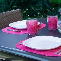 Fishnet 17 in. x 12 in. Pink Yarrow PVC Covered Jute Oval Placemat (Set of 6) by Kraftware -Kraftware Sales Store reds pinks kraftware placemats 39446 31 1000