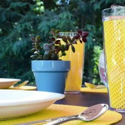 Fishnet 17 in. x 12 in. Yellow PVC Covered Jute Oval Placemat (Set of 6) by Kraftware -Kraftware Sales Store yellows golds kraftware placemats 11646 4f 1000