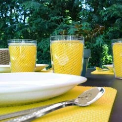 Fishnet 19 in. x 13 in. Yellow PVC Covered Jute Wedge Placemat (Set of 6) by Kraftware -Kraftware Sales Store yellows golds kraftware placemats 11649 4f 1000